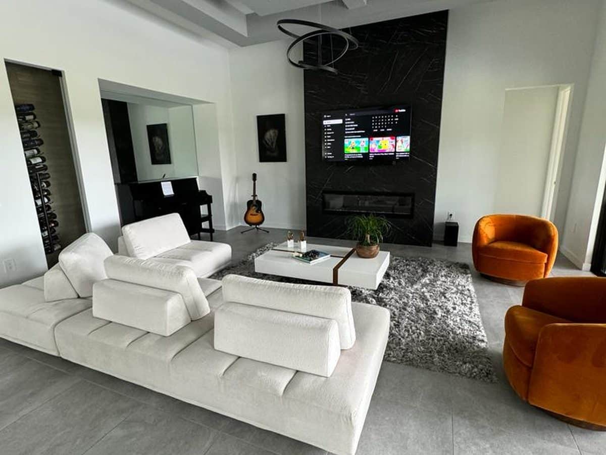 A freshly repainted living room with crisp white walls and trim